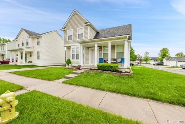 32051 W Cranston St, New Haven, MI 48048 - view of front of house featuring a porch and a front lawn