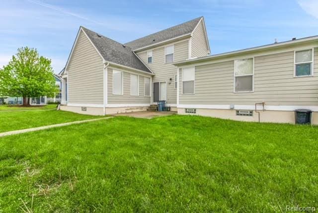 32051 W Cranston St, New Haven, MI 48048 - rear view of house featuring a yard