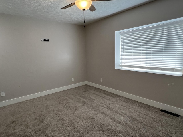 1302 Barnes St, Albion, MI 49224 - spare room featuring a ceiling fan, a textured ceiling, carpet, and baseboards