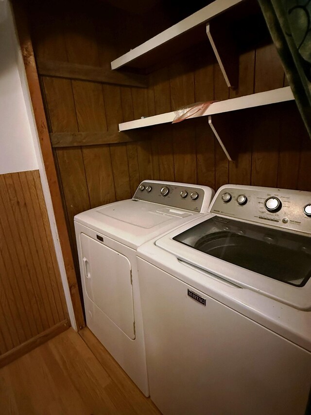 10750 16 Mile Rd NE, Cedar Springs, MI 49319 - laundry area featuring washer and dryer and light wood-style floors
