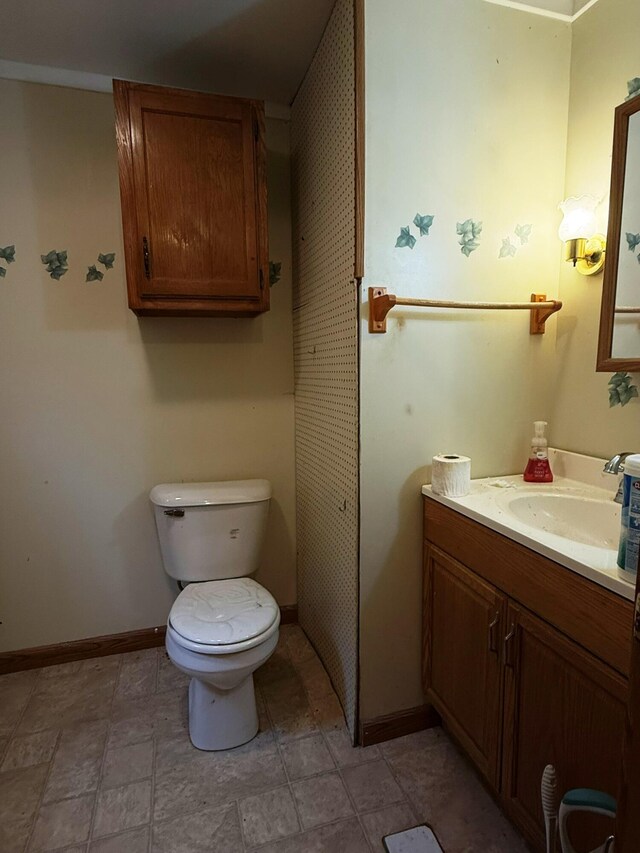 10750 16 Mile Rd NE, Cedar Springs, MI 49319 - bathroom with vanity, baseboards, and toilet