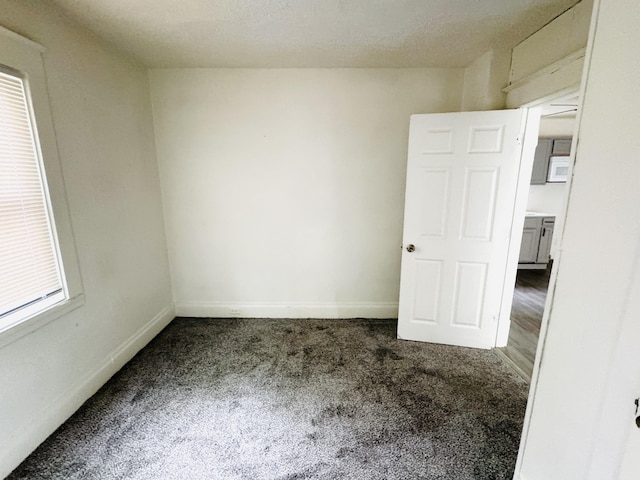 2513 5th St, Muskegon, MI 49444 - unfurnished room featuring carpet floors and baseboards