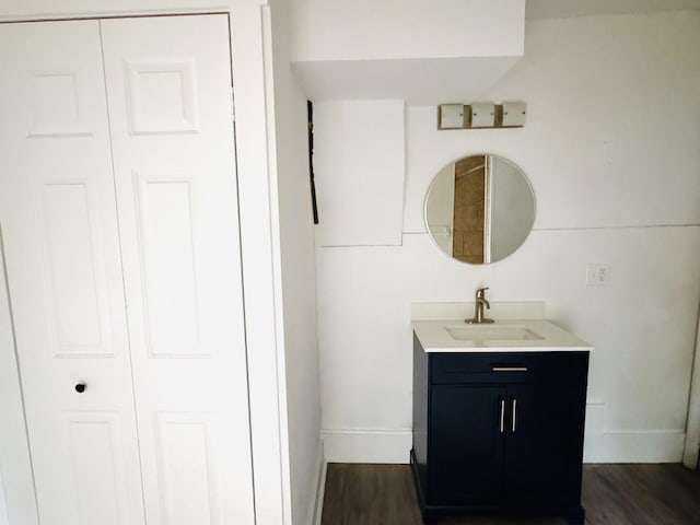 2513 5th St, Muskegon, MI 49444 - bathroom with vanity, baseboards, and wood finished floors