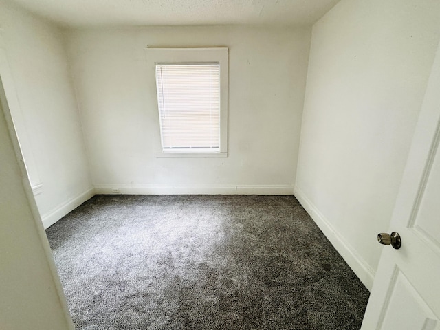 2513 5th St, Muskegon, MI 49444 - carpeted spare room featuring baseboards