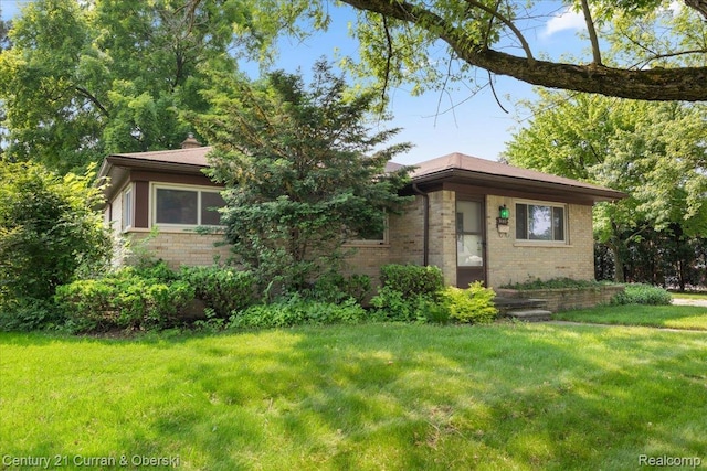 3183 Mildred St, Wayne, MI 48184 - view of front of house featuring brick siding and a front lawn