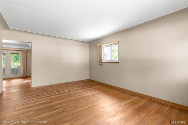 3183 Mildred St, Wayne, MI 48184 - empty room featuring plenty of natural light, light wood-style flooring, and baseboards