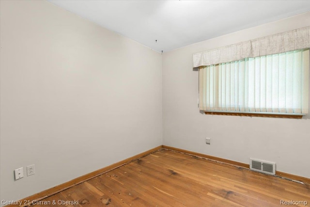 3183 Mildred St, Wayne, MI 48184 - spare room with baseboards and hardwood / wood-style floors