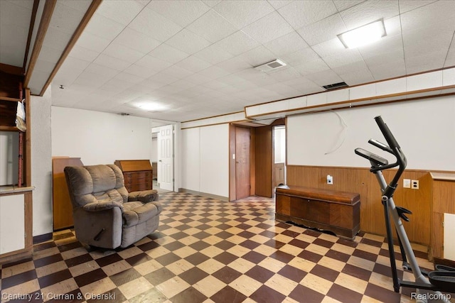 3183 Mildred St, Wayne, MI 48184 - sitting room with light floors, a wainscoted wall, and wood walls