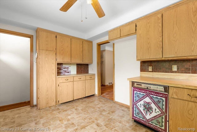 3183 Mildred St, Wayne, MI 48184 - kitchen featuring backsplash, light countertops, baseboards, and a ceiling fan