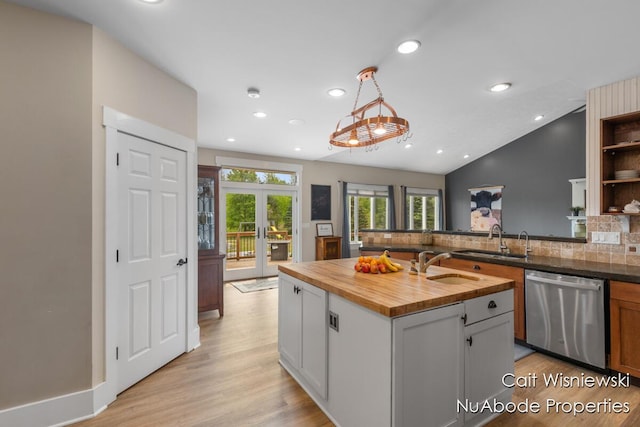 3732 E 128th St, Grant, MI 49327 - kitchen with dishwasher, butcher block countertops, a sink, decorative backsplash, and recessed lighting
