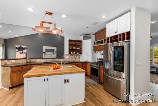 3732 E 128th St, Grant, MI 49327 - kitchen with appliances with stainless steel finishes, butcher block counters, open shelves, light wood-style floors, and recessed lighting