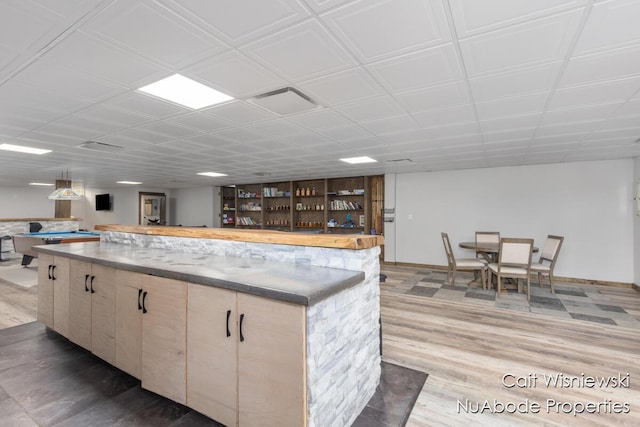 3732 E 128th St, Grant, MI 49327 - kitchen with wood finished floors, a kitchen island, and open floor plan