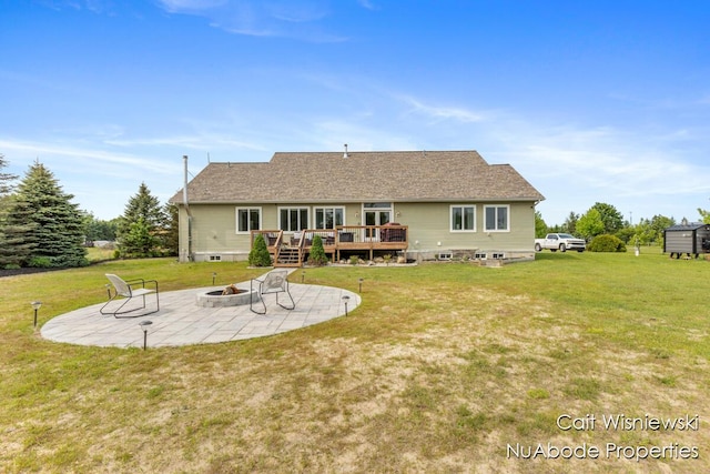 3732 E 128th St, Grant, MI 49327 - rear view of house featuring a deck, a patio, an outdoor fire pit, and a yard