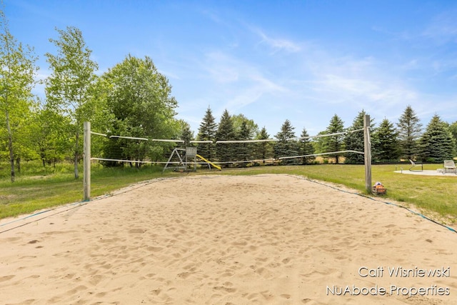 3732 E 128th St, Grant, MI 49327 - view of home's community with volleyball court, a lawn, and view of wooded area