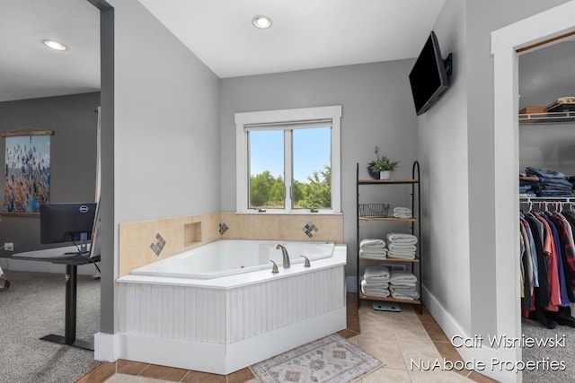 3732 E 128th St, Grant, MI 49327 - full bathroom featuring a tub with jets, a spacious closet, recessed lighting, and baseboards