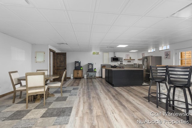 3732 E 128th St, Grant, MI 49327 - living area featuring wood finished floors and baseboards