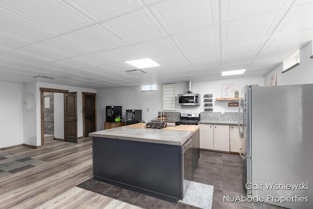 3732 E 128th St, Grant, MI 49327 - kitchen with appliances with stainless steel finishes, a center island, white cabinets, open shelves, and light countertops