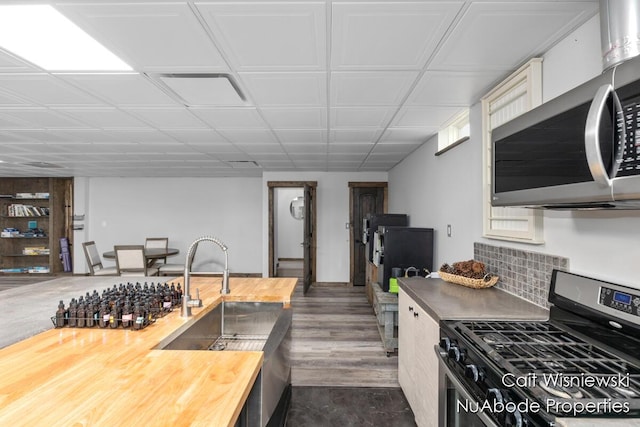 3732 E 128th St, Grant, MI 49327 - kitchen with appliances with stainless steel finishes, wood counters, and dark wood-type flooring