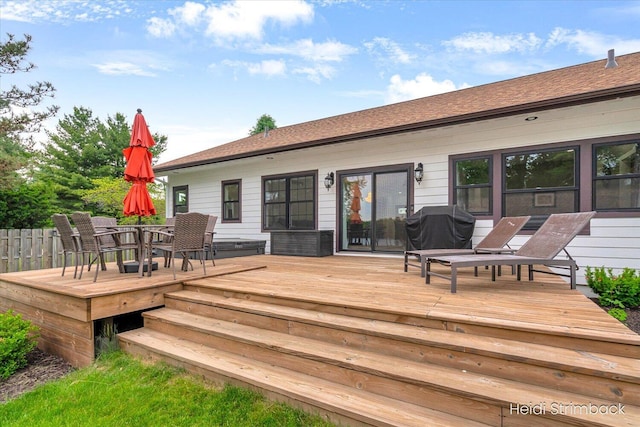 1200 Iroquois Trl, Hastings, MI 49058 - wooden deck featuring outdoor dining space and a grill