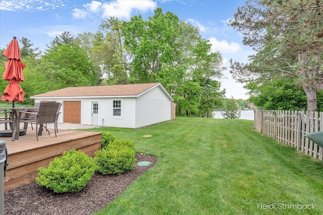 1200 Iroquois Trl, Hastings, MI 49058 - view of yard with an outdoor structure, a deck with water view, outdoor dining area, and a garage