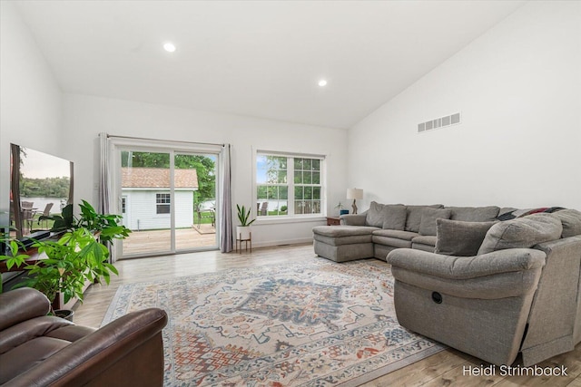 1200 Iroquois Trl, Hastings, MI 49058 - living room featuring lofted ceiling, recessed lighting, and light wood-type flooring