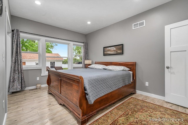1200 Iroquois Trl, Hastings, MI 49058 - bedroom featuring baseboards, light wood finished floors, and recessed lighting