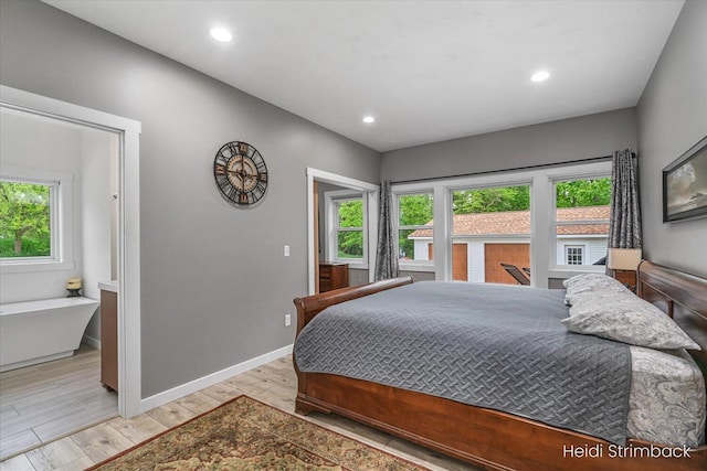 1200 Iroquois Trl, Hastings, MI 49058 - bedroom with light wood-style flooring, baseboards, and recessed lighting