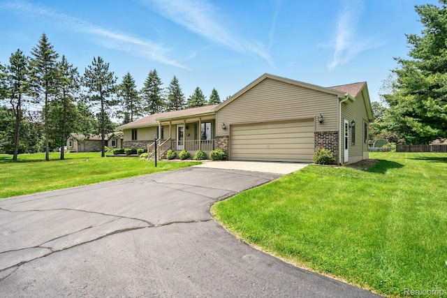 321 Myers Rd, Lapeer, MI 48446 - ranch-style house featuring a porch, asphalt driveway, an attached garage, and brick siding
