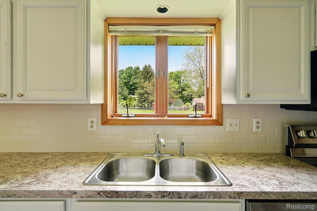 321 Myers Rd, Lapeer, MI 48446 - kitchen featuring a sink, light countertops, decorative backsplash, and white cabinets
