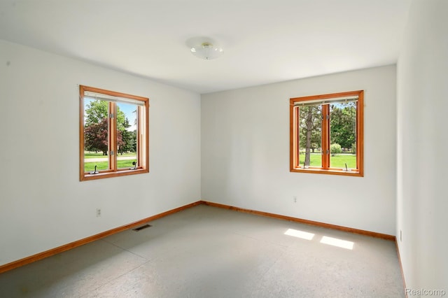 321 Myers Rd, Lapeer, MI 48446 - spare room with plenty of natural light and baseboards