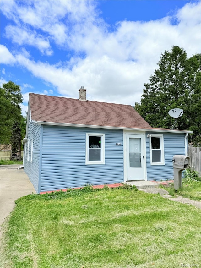 2995 Alvina Ave, Warren, MI 48091 - view of front of house featuring a chimney and a shingled roof