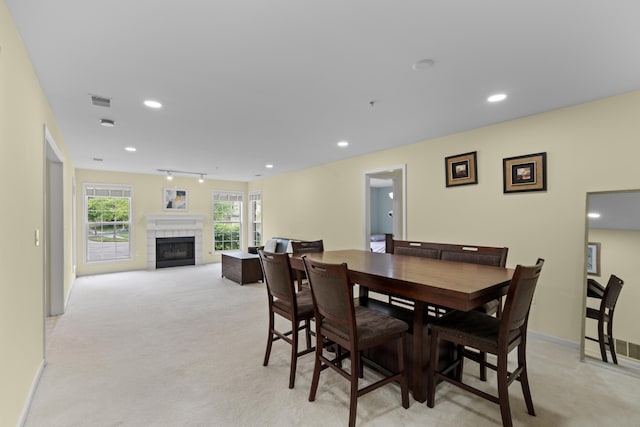 28067 Carlton Way Dr, Novi, MI 48377 - dining space featuring light carpet, a tile fireplace, recessed lighting, and baseboards