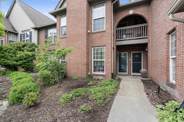 28067 Carlton Way Dr, Novi, MI 48377 - doorway to property with a balcony and brick siding
