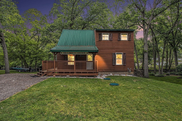 283 S Fremont Rd, Coldwater, MI 49036 - view of front of home featuring a lawn, metal roof, and a porch