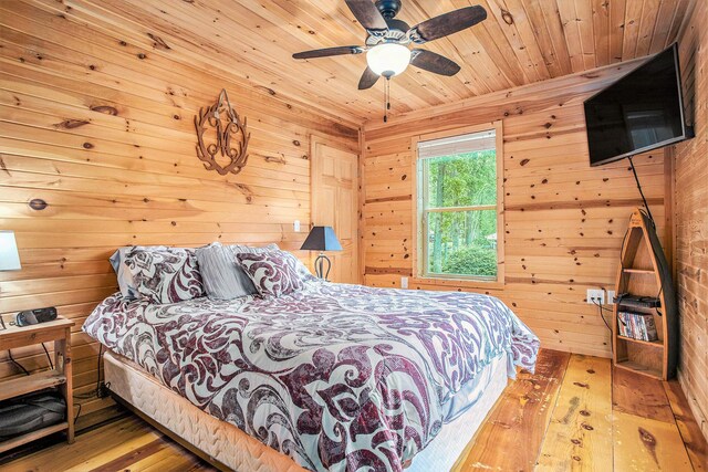 283 S Fremont Rd, Coldwater, MI 49036 - bedroom featuring wood-type flooring, wood walls, wooden ceiling, and ceiling fan