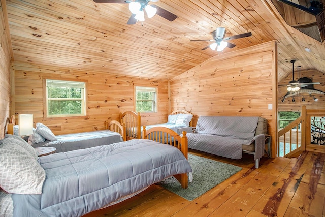 283 S Fremont Rd, Coldwater, MI 49036 - bedroom with lofted ceiling, wood-type flooring, wooden walls, wooden ceiling, and ceiling fan