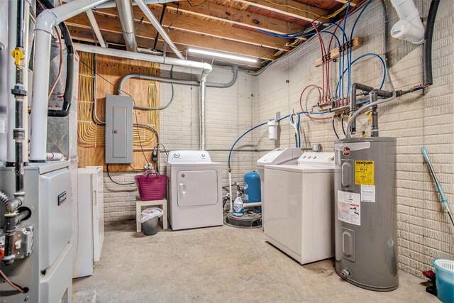 283 S Fremont Rd, Coldwater, MI 49036 - unfinished basement with washer and dryer, electric water heater, electric panel, and brick wall