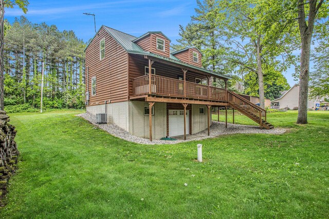 283 S Fremont Rd, Coldwater, MI 49036 - back of house with a garage, a deck, a lawn, and stairway