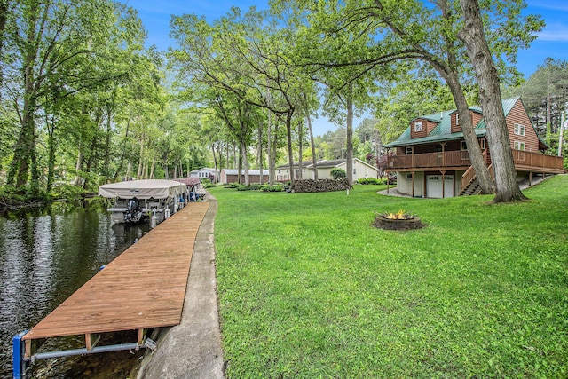 283 S Fremont Rd, Coldwater, MI 49036 - view of grassy yard featuring a dock, an outdoor fire pit, and a deck with water view