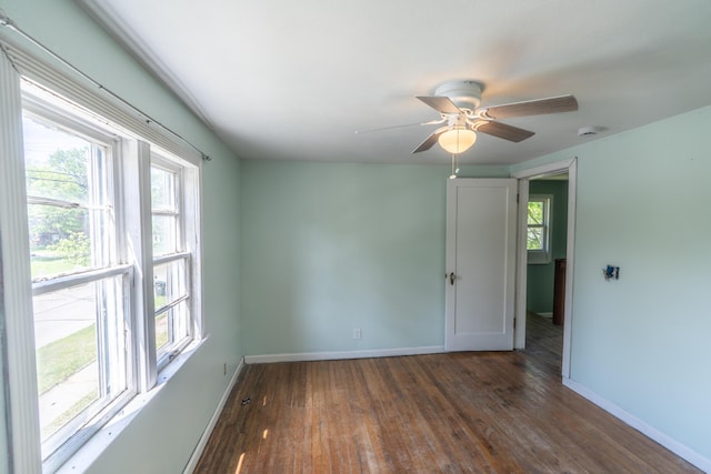 428 Orchard Ave, Muskegon, MI 49442 - unfurnished room with wood finished floors, baseboards, ceiling fan, and a smoke detector