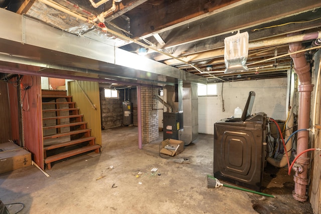 428 Orchard Ave, Muskegon, MI 49442 - below grade area with heating unit, water heater, stairs, and healthy amount of natural light