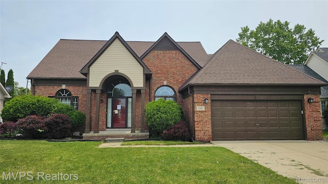 540 Clairpointe Woods Dr, Detroit, MI 48215 - view of front facade featuring brick siding, a front lawn, concrete driveway, and a garage