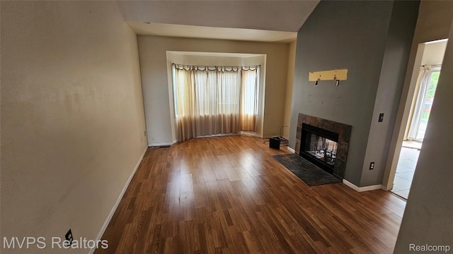 540 Clairpointe Woods Dr, Detroit, MI 48215 - unfurnished living room featuring wood finished floors, baseboards, and a tile fireplace