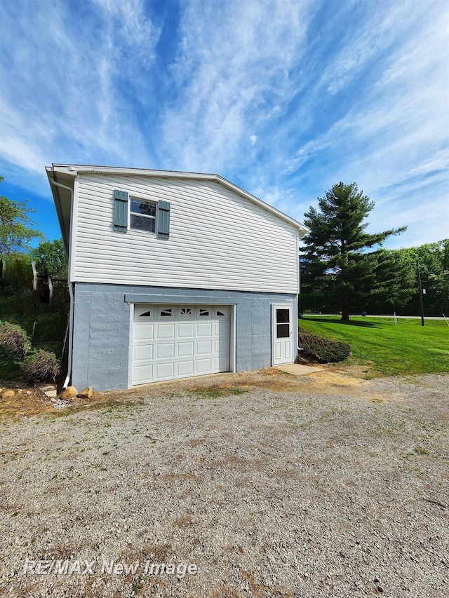 10424 S Graham Rd, Saint Charles, MI 48655 - view of home's exterior featuring dirt driveway and an attached garage