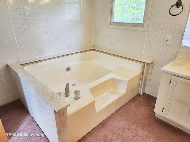 10424 S Graham Rd, Saint Charles, MI 48655 - full bathroom featuring vanity, a garden tub, tile walls, and carpet