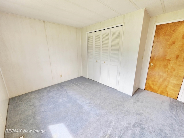 10424 S Graham Rd, Saint Charles, MI 48655 - unfurnished bedroom featuring carpet floors and a closet
