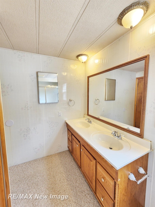 10424 S Graham Rd, Saint Charles, MI 48655 - bathroom featuring double vanity and a textured ceiling