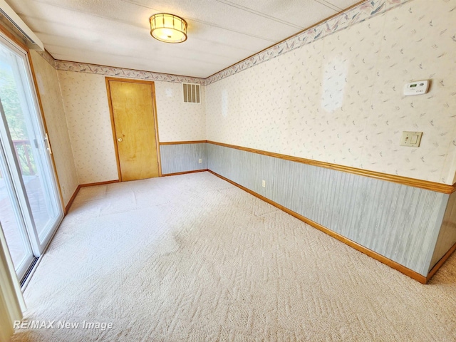 10424 S Graham Rd, Saint Charles, MI 48655 - carpeted empty room with wallpapered walls and baseboards