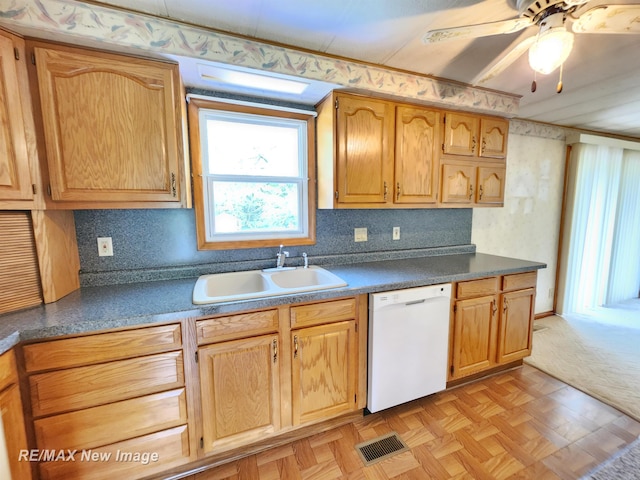 10424 S Graham Rd, Saint Charles, MI 48655 - kitchen with white dishwasher, a sink, dark countertops, and ceiling fan