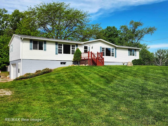 10424 S Graham Rd, Saint Charles, MI 48655 - view of front facade featuring a deck, an attached garage, and a front yard